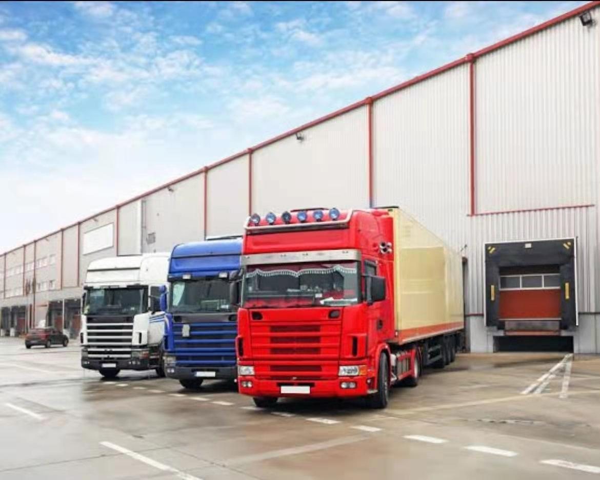 Refrigerated trucks loading at a distribution warehouse
